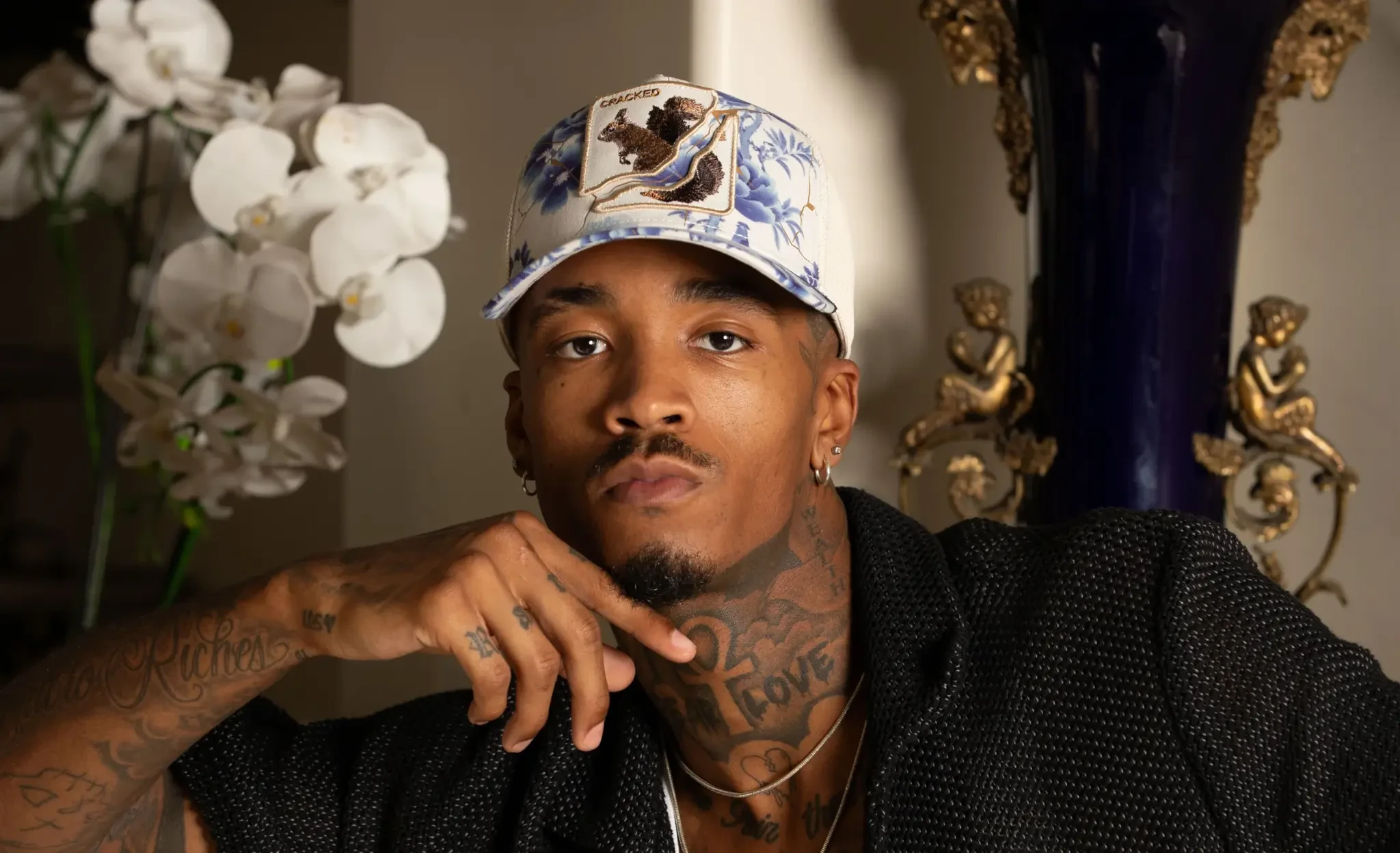 how to style a cap, streetwear caps, motorsport streetwear, windbreaker outfits, oversized t shirts, UK streetwear 2026
